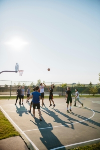 teenagers playing basketball