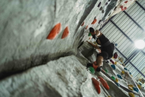rock climber using difficult footwork technique