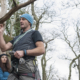 Climbers preparing for their next ascent in a lush, green setting.
